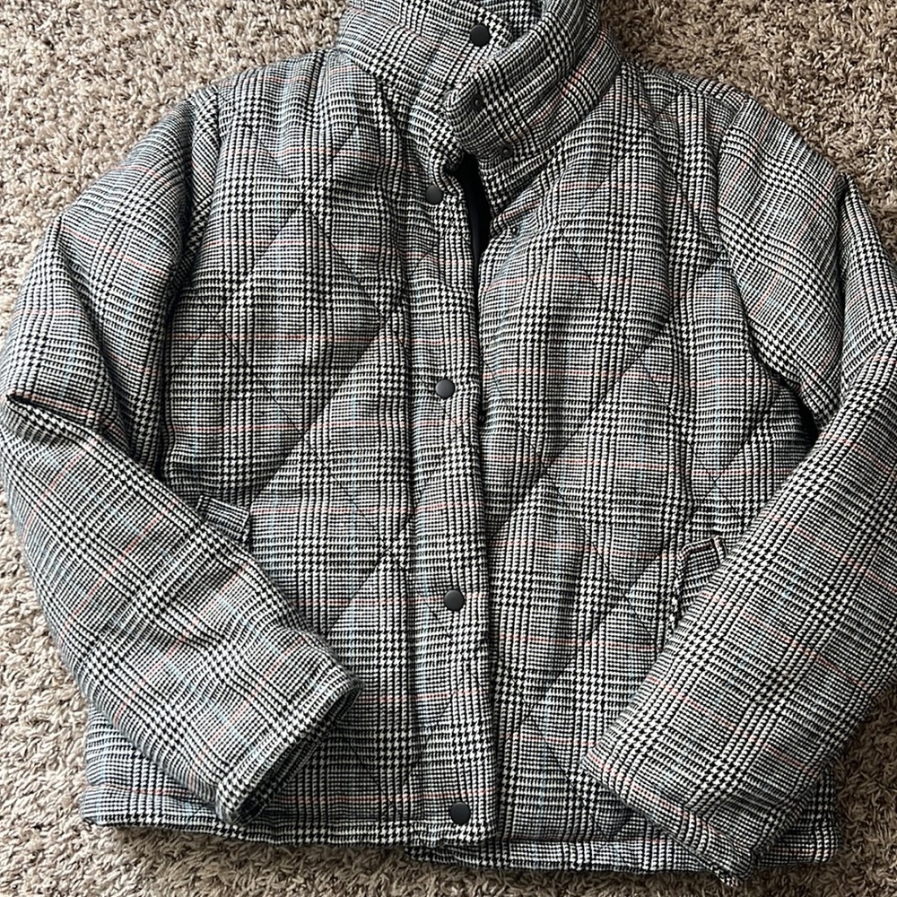 Black with pops of blue and and orange quilted pattern bomber